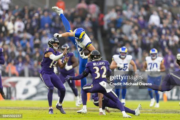 Davis Allen of the Los Angeles Rams leaps against the Baltimore Ravens during an NFL football game between the Baltimore Ravens and the Los Angeles...