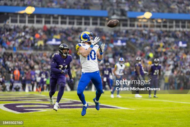 Cooper Kupp of the Los Angeles Rams completes a pass for a touchdown against Marcus Williams of the Baltimore Ravens during an NFL football game...