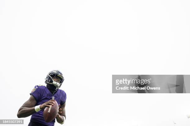 Lamar Jackson of the Baltimore Ravens looks to pass as he warms up prior to an NFL football game between the Baltimore Ravens and the Los Angeles...