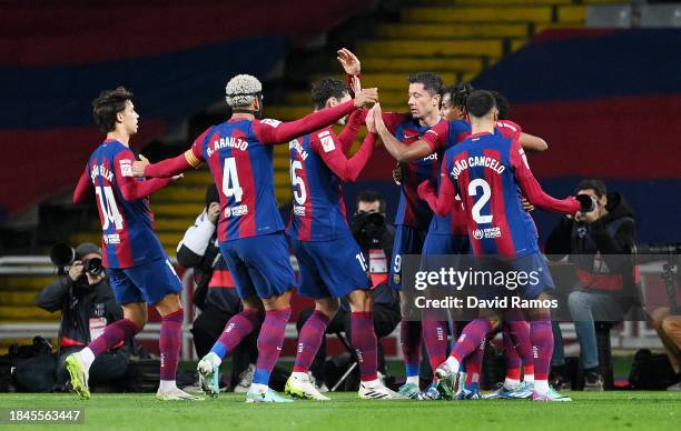 Robert Lewandowski of FC Barcelona celebrates with teammates after scoring their team's first goal during the LaLiga EA Sports match between FC...