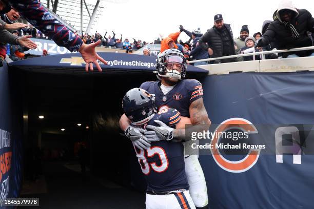 Moore of the Chicago Bears celebrates after a touchdown with Cole Kmet during the third quarter in the game against the Detroit Lions at Soldier...