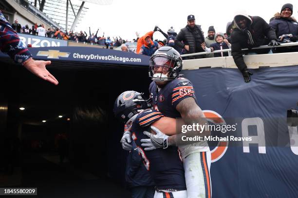 Moore of the Chicago Bears celebrates after a touchdown with Cole Kmet during the third quarter in the game against the Detroit Lions at Soldier...