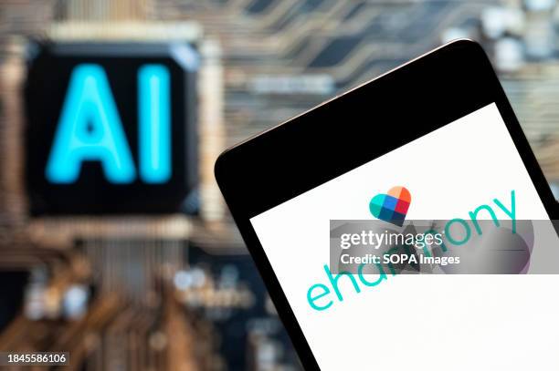 In this photo illustration, the online dating website Eharmony logo seen displayed on a smartphone with an Artificial intelligence chip and symbol in...