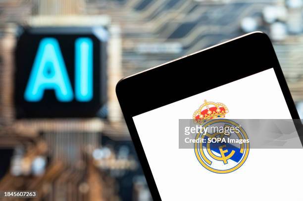 In this photo illustration, the Spanish professional LaLiga football club team Real Madrid Club de Fútbol, commonly known as the Real Madrid, logo...