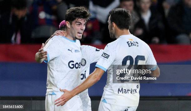 Miguel Gutierrez of Girona FC celebrates with Eric Garcia of Girona FC after scoring their team's second goal during the LaLiga EA Sports match...