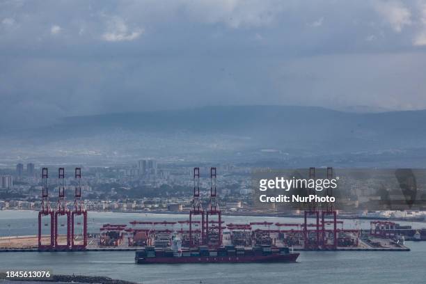 Cargo ships are seen at Israel's Haifa commercial shipping port in the Mediterranean Sea on December 13, 2023. In solidarity with Palestinians in...