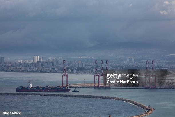 Cargo ships are seen at Israel's Haifa commercial shipping port in the Mediterranean Sea on December 13, 2023. In solidarity with Palestinians in...