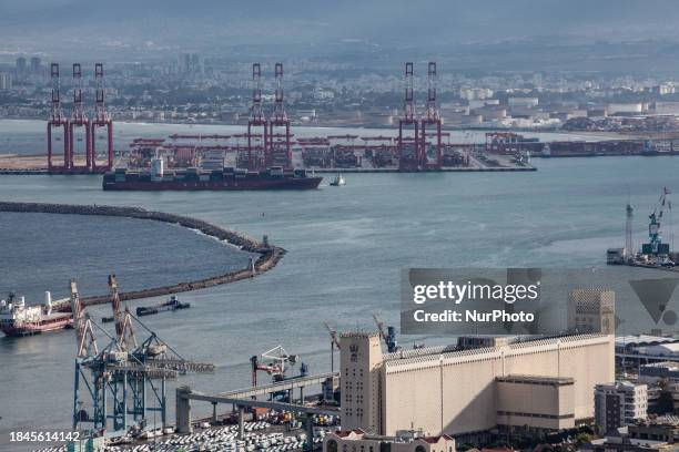 Cargo ships are seen at Israel's Haifa commercial shipping port in the Mediterranean Sea on December 13, 2023. In solidarity with Palestinians in...