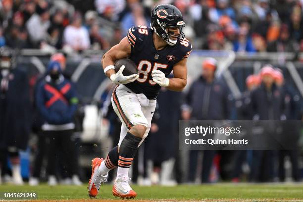 Cole Kmet of the Chicago Bears runs the ball after a catch during the second quarter in the game against the Detroit Lions at Soldier Field on...