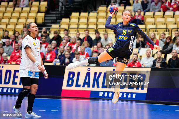 Sweden's wing Elin Hansson throws the ball during the quarter final match between Sweden and Germany of the IHF World Women's Handball Championship...