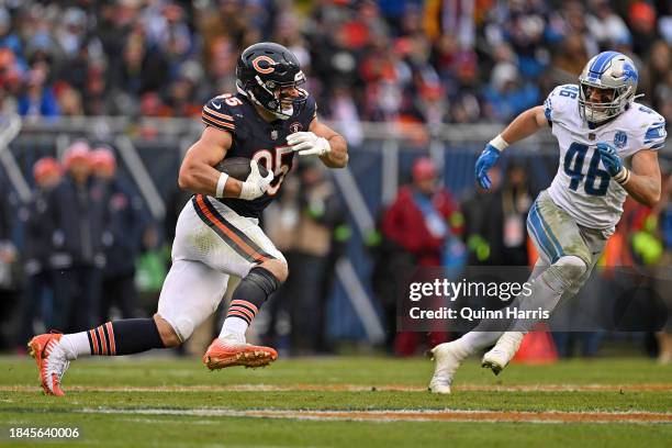 Cole Kmet of the Chicago Bears runs the ball after a catch during the second half in the game against the Detroit Lions at Soldier Field on December...