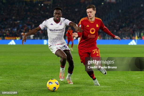Michael Kayode of ACF Fiorentina battles for possession with Nicola Zalewski of AS Roma during the Serie A TIM match between AS Roma and ACF...