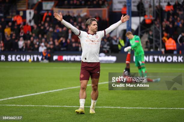 Jack Grealish of Manchester City celebrates scoring the winning goal during the Premier League match between Luton Town and Manchester City at...