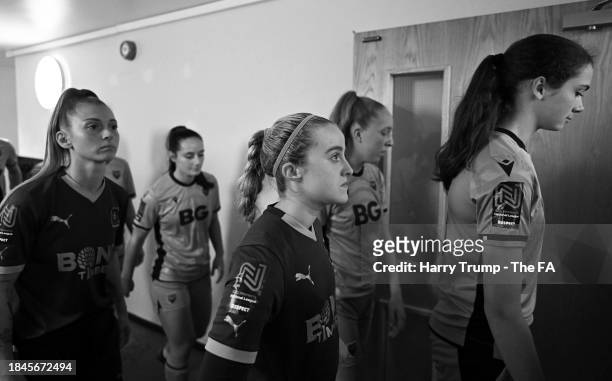 Players of Plymouth Argyle Women and Oxford United Women make their way out ahead of the Adobe Women's FA Cup Third Round match between Plymouth...