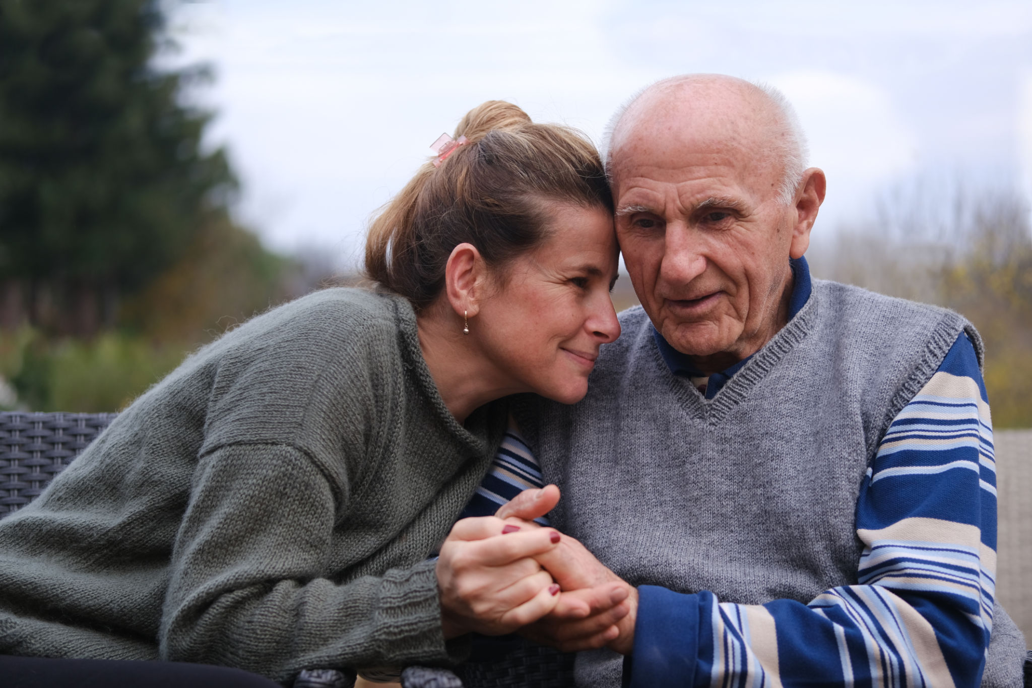 Elderly father and daughter holding hands Elderly father and daughter holding hands