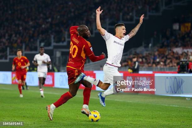 Silvi Clua of Girona FC is tackled by Romelu Lukaku of AS Roma during the Serie A TIM match between AS Roma and ACF Fiorentina at Stadio Olimpico on...