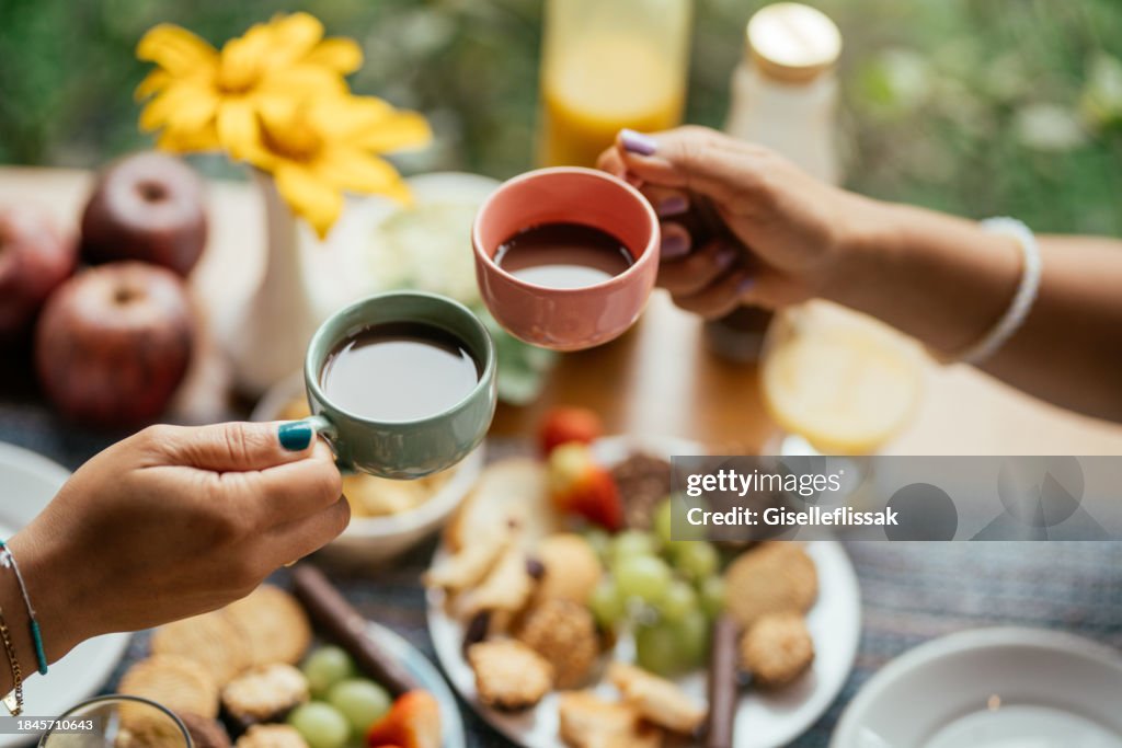 Couple drinking coffee together over breakfast on the patio of a BnB