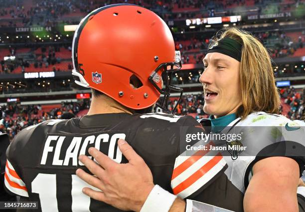 Joe Flacco of the Cleveland Browns talks with Trevor Lawrence of the Jacksonville Jaguars after the game at Cleveland Browns Stadium on December 10,...