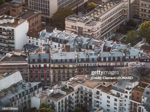 row of apartments and residential buildings in the haussmannian (haussmannien) style seen from above, paris, ile-de-france (ile de france), central france. - tour montparnasse stock pictures, royalty-free photos & images