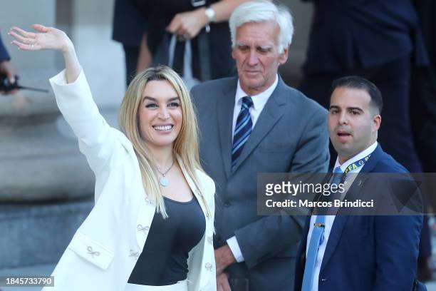 Javier Milei's girlfriend actress Fatima Florez waves supporters before an interreligious service at the Metropolitan Cathedral after the...