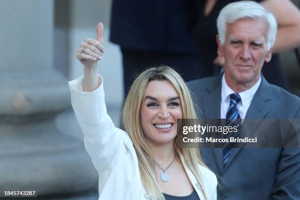 Javier Milei's girlfriend actress Fatima Florez waves supporters before an interreligious service at the Metropolitan Cathedral after the...