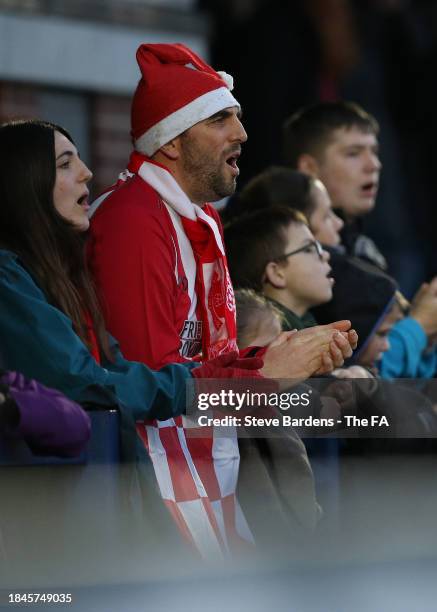 Southampton supporter wearing a Santa hat look on during the Adobe Women's FA Cup Third Round match between Portsmouth Women v Southampton F.C. Women...