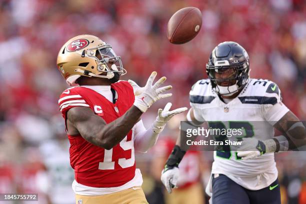 Deebo Samuel of the San Francisco 49ers catches a pass for a touchdown over Jamal Adams of the Seattle Seahawks during the second quarter at Levi's...