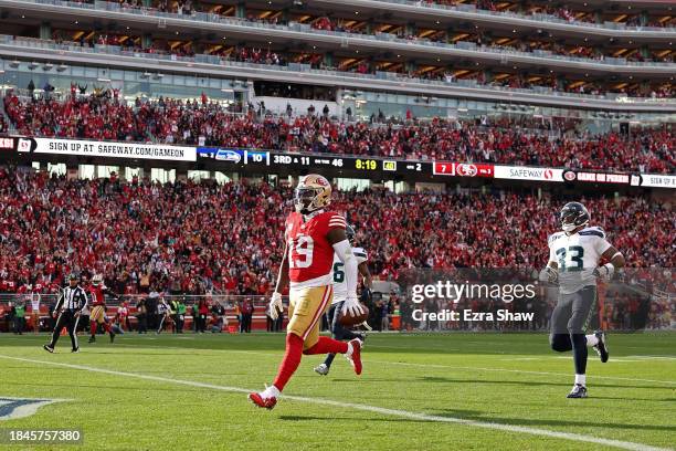 Deebo Samuel of the San Francisco 49ers scores a touchdown during the second quarter in the game against the Seattle Seahawks at Levi's Stadium on...