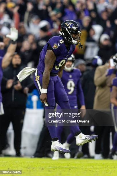 Lamar Jackson of the Baltimore Ravens celebrates after passing for a touchdown during an NFL football game between the Baltimore Ravens and the Los...