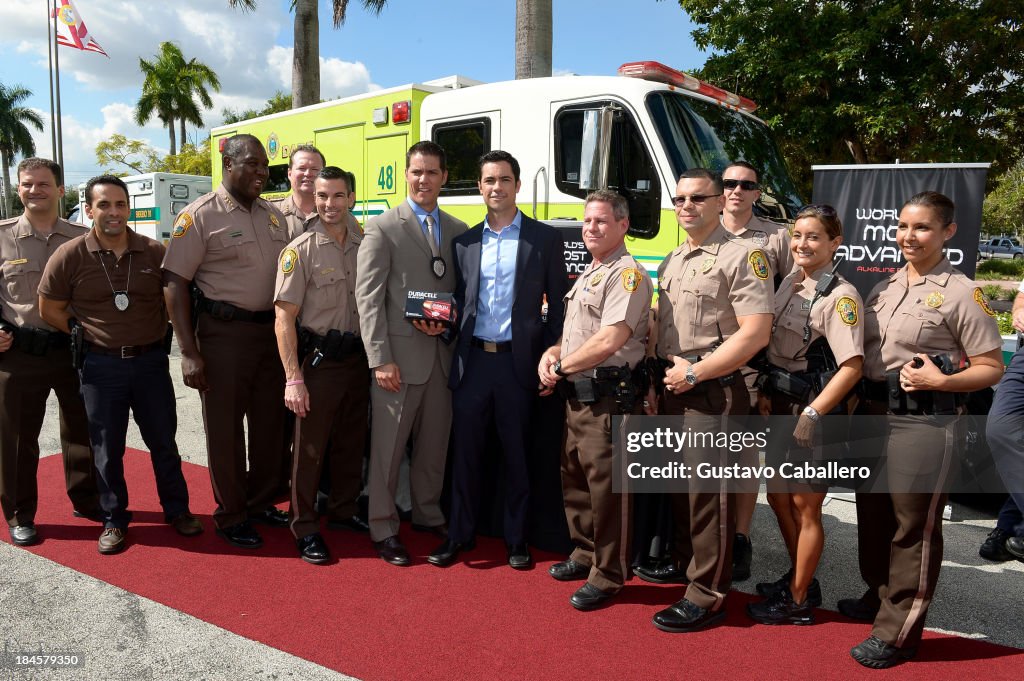Danny Pino Presents Batteries To First Responders