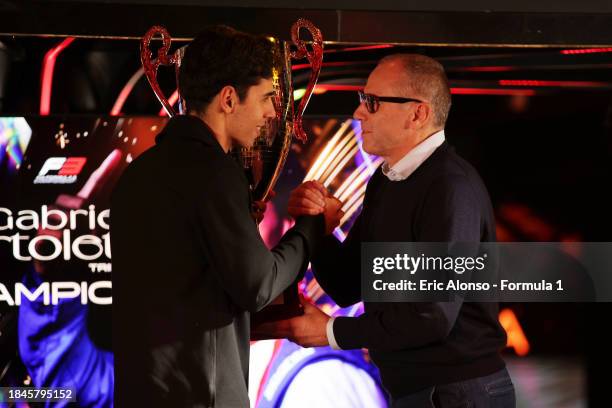 Stefano Domenicali, CEO of the Formula One Group, presents the Formula 3 Drivers Champion trophy to Gabriel Bortoleto of Brazil and Trident during...