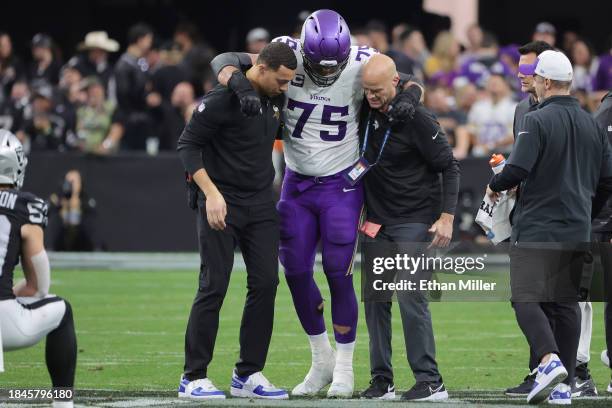 Brian O'Neill of the Minnesota Vikings is injured during the first half of the game against the Las Vegas Raiders at Allegiant Stadium on December...