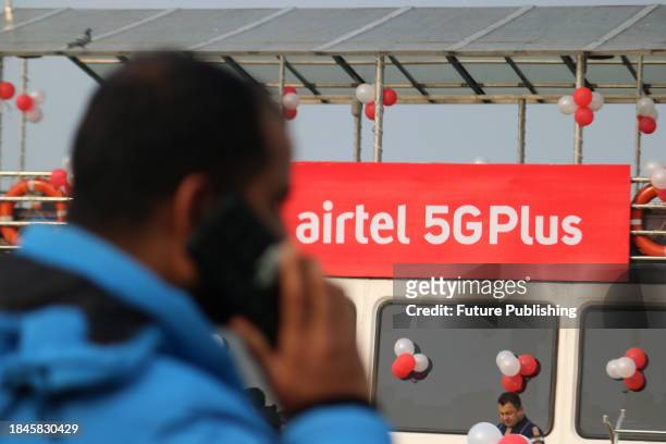 December 12 Srinagar Kashmir, India : A man talks on his mobile phone during the live 5G plus experience. Airtel announced the launch of its cutting...