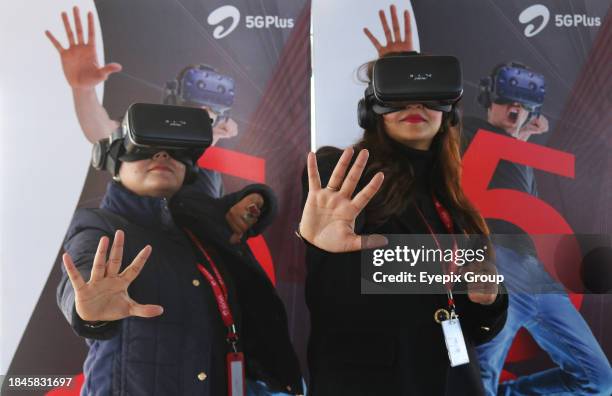 December 12 Srinagar Kashmir, India : Women members of Bharti Airtel pose during the live 5G plus experience. Airtel announced the launch of its...