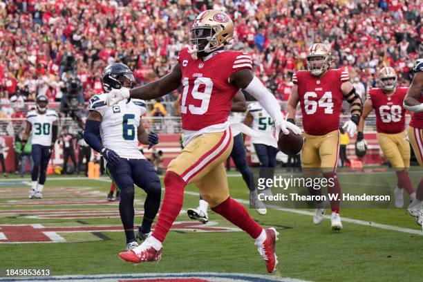 Deebo Samuel of the San Francisco 49ers scores a touchdown during the third quarter in the game against the Seattle Seahawks at Levi's Stadium on...