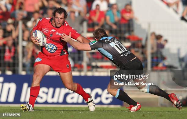 Carl Hayman of Toulon is tackled by Pat MacArthur during the Heineken Cup Pool 2 match between Toulon and Glasgow Warriors at the Felix Mayol Stadium...