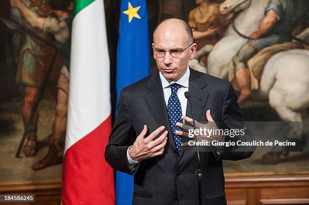 Italian Prime Minister Enrico Letta gestures as he attends a meeting with the Jewish Community to commemorate the 70th anniversary of the deportation...