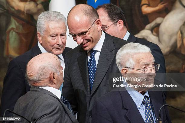 Italian Prime Minister Enrico Letta talks with members of the Jewish Community at the end of a meeting with to commemorate the 70th anniversary of...