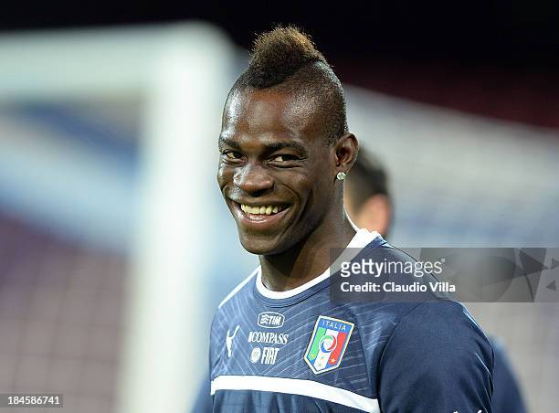 Mario Balotelli of Italy smiles during a training session on October 14, 2013 in Naples, Italy.