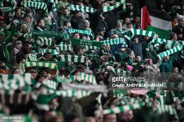 Celtic's supporters cheer during the UEFA Champions League group E football match between Celtic and Fyenoord at Celtic Park stadium in Glasgow on...