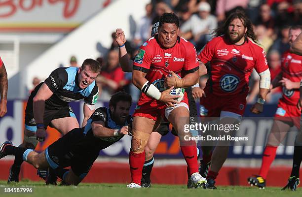 Chris Masoe of Toulon is tackled during the Heineken Cup Pool 2 match between Toulon and Glasgow Warriors at the Felix Mayol Stadium on October 13,...