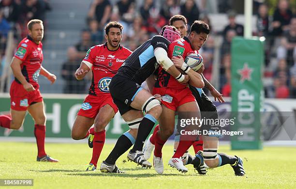 David Smith of Toulon is tackled during the Heineken Cup Pool 2 match between Toulon and Glasgow Warriors at the Felix Mayol Stadium on October 13,...