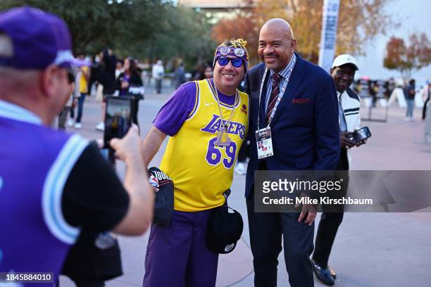 Michael Wilbon poses for photo with fan before the game between the New Orleans Pelicans and Los Angeles Lakers as part of the 2023 NBA In-Season...