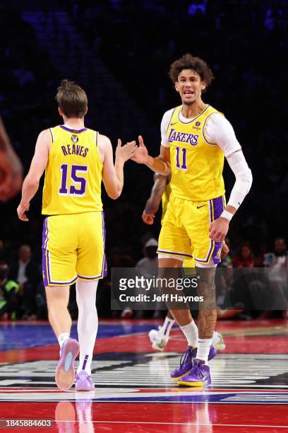Jaxson Hayes and Austin Reaves of the Los Angeles Lakers high five during the game against the New Orleans Pelicans during the semifinals of the...