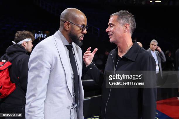 Andre Iguodala and General Manager Rob Pelinka of the Los Angeles Lakers talk before the game between the New Orleans Pelicans and Los Angeles Lakers...