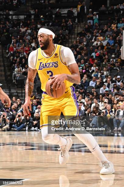 Anthony Davis of the Los Angeles Lakers handles the ball during the game against the San Antonio Spurs on December 13, 2023 at the Frost Bank Center...