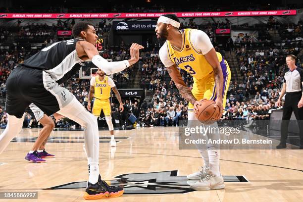 Anthony Davis of the Los Angeles Lakers handles the ball during the game against the San Antonio Spurs on December 13, 2023 at the Frost Bank Center...