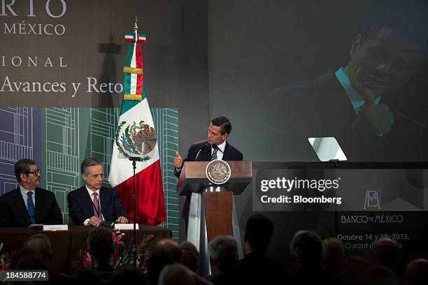 Enrique Pena Nieto, Mexico's president, right, speaks during the Banco de Mexico 20th Anniversary Of Independence Conference in Mexico City, Mexico,...