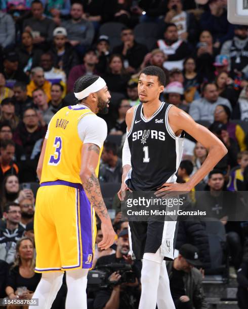 Anthony Davis of the Los Angeles Lakers and Victor Wembanyama of the San Antonio Spurs look on during the game on December 13, 2023 at the Frost Bank...