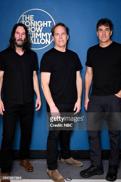 Episode 1890 -- Pictured: Keanu Reeves, Brett Domrose, and Robert Mailhouse of musical guest Dogstar pose together backstage on Wednesday, December...
